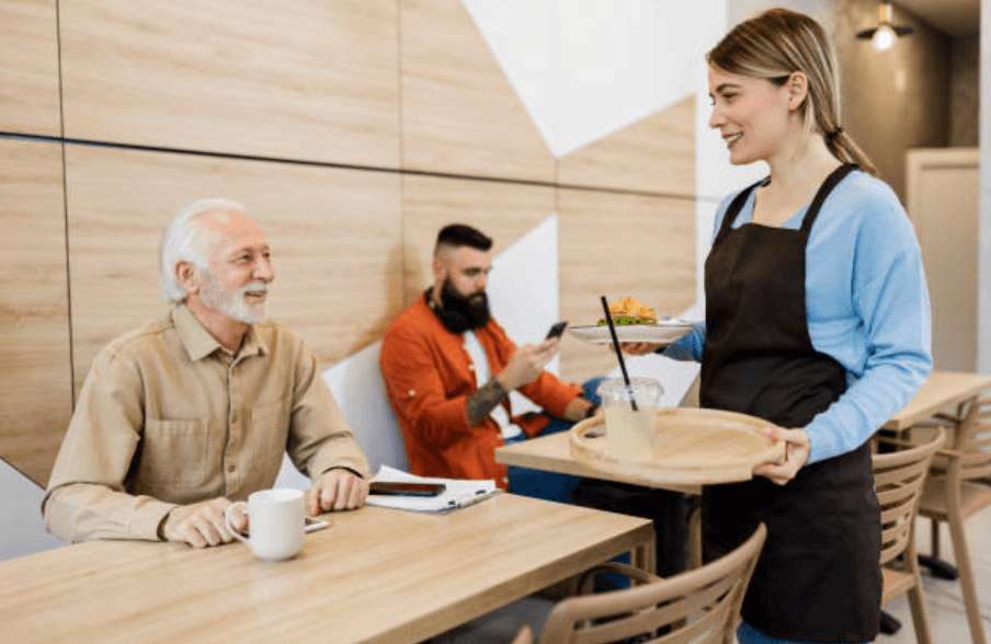 Waiters serving guests
